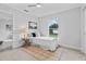 A cozy bedroom with a twin bed, carpet, lamp, and window with natural light at 19073 Sabal St, Orlando, FL 32833