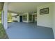 Spacious covered patio area with neutral tones, providing ample space for outdoor entertaining and relaxation at 19073 Sabal St, Orlando, FL 32833