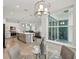 Dining area with view into open floor plan with hardwood floors and view to exterior at 19073 Sabal St, Orlando, FL 32833