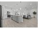 Open concept kitchen with stainless steel appliances, large island, and hardwood floors at 19073 Sabal St, Orlando, FL 32833