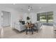 Bright living room featuring neutral colors, comfortable seating, modern decor, and sliding glass doors to the outdoor space at 19073 Sabal St, Orlando, FL 32833