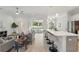 Open concept living room and kitchen with stainless appliances and hardwood flooring at 19073 Sabal St, Orlando, FL 32833