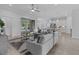 Bright and airy living room featuring modern decor, gray couches, and hardwood floors at 19073 Sabal St, Orlando, FL 32833