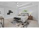 Inviting main bedroom with tray ceiling, large bed, and plenty of natural light at 19073 Sabal St, Orlando, FL 32833