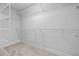 Spacious walk-in closet with shelving and ample storage space for clothing and accessories at 19073 Sabal St, Orlando, FL 32833
