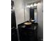 Bathroom featuring dark vanity, copper colored sink, and modern fixtures at 1950 Summer Club Dr # 202, Oviedo, FL 32765