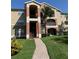 Inviting exterior showcasing well-maintained grounds and colorful architecture, enhancing curb appeal at 1950 Summer Club Dr # 202, Oviedo, FL 32765