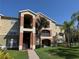 Inviting exterior showcasing well-maintained grounds and colorful architecture, enhancing curb appeal at 1950 Summer Club Dr # 202, Oviedo, FL 32765