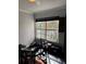 View of room with drum set, large window and black tile flooring at 1950 Summer Club Dr # 202, Oviedo, FL 32765