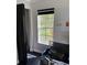 Bright room with a large window offering ample natural light and black tile flooring at 1950 Summer Club Dr # 202, Oviedo, FL 32765