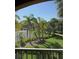 Beautiful view of tennis courts and green space from a screened balcony at 1950 Summer Club Dr # 202, Oviedo, FL 32765
