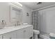 Bright bathroom featuring a vanity with marble countertop and updated shower with subway tile and modern fixtures at 200 Maitland Ave # 19, Altamonte Springs, FL 32701