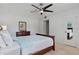 This bedroom features a ceiling fan, a Queen-size bed, and neutral walls at 200 Maitland Ave # 19, Altamonte Springs, FL 32701