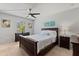 This bedroom features a ceiling fan, a Queen-size bed, and neutral walls at 200 Maitland Ave # 19, Altamonte Springs, FL 32701