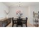 Dining room featuring a table with seating, decorative lighting, and an adjacent living area at 200 Maitland Ave # 19, Altamonte Springs, FL 32701