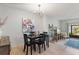 Dining room with modern chandelier and neutral color palette at 200 Maitland Ave # 19, Altamonte Springs, FL 32701