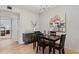 Open dining room featuring a table with seating, decorative lighting, and wood floors at 200 Maitland Ave # 19, Altamonte Springs, FL 32701