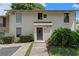Inviting condo exterior featuring a well-maintained facade and beautiful landscaping at 200 Maitland Ave # 19, Altamonte Springs, FL 32701