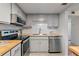 This efficient kitchen features gray cabinets, stainless appliances, and wood countertops at 200 Maitland Ave # 19, Altamonte Springs, FL 32701