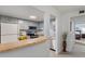 Charming kitchen area featuring modern appliances, bar seating, and ample cabinet space at 200 Maitland Ave # 19, Altamonte Springs, FL 32701