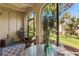 Inviting lanai with comfortable seating, outdoor views, and tropical plants at 200 Maitland Ave # 19, Altamonte Springs, FL 32701