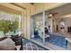 Bright lanai connected to the interior living space with comfortable seating and pleasant views at 200 Maitland Ave # 19, Altamonte Springs, FL 32701
