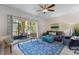 The living room features a ceiling fan, lots of natural light, and a comfy sitting area at 200 Maitland Ave # 19, Altamonte Springs, FL 32701