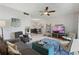 This open living room includes a ceiling fan, neutral walls, and a view to the dining area at 200 Maitland Ave # 19, Altamonte Springs, FL 32701