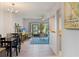 Bright living room with wood floors and sliding glass doors to the outside seating area at 200 Maitland Ave # 19, Altamonte Springs, FL 32701