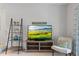 This living room includes neutral walls and an entertainment center with television at 200 Maitland Ave # 19, Altamonte Springs, FL 32701
