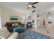 This comfortable living room has a ceiling fan, neutral walls, and an accent rug at 200 Maitland Ave # 19, Altamonte Springs, FL 32701