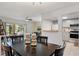Open living area with dining table with seating, and a pass-through to the kitchen at 200 Maitland Ave # 19, Altamonte Springs, FL 32701