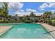 Large community pool surrounded by lush landscaping at 200 Maitland Ave # 19, Altamonte Springs, FL 32701