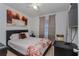 Cozy bedroom featuring a comfortable bed, floral patterned bedding, and soft natural light at 2304 N Hastings St, Orlando, FL 32808
