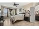 Cozy bedroom with tile flooring, a large window, and neutral decor, creating a relaxing space at 259 Blue Cypress Dr, Groveland, FL 34736