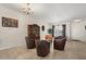 Welcoming living area with tile floors, a decorative cabinet, and plenty of seating for guests at 259 Blue Cypress Dr, Groveland, FL 34736