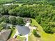Aerial view of a home on a cul-de-sac, surrounded by lush greenery and mature trees at 2607 Stanmore Ct, Orlando, FL 32817