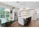 Spacious kitchen featuring stainless steel appliances and a large center island with barstool seating at 2607 Stanmore Ct, Orlando, FL 32817