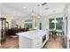 Open-concept kitchen with island that connects to the living room and dining area at 2607 Stanmore Ct, Orlando, FL 32817