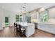 Bright kitchen features a center island, stainless steel appliances, and farmhouse sink at 2607 Stanmore Ct, Orlando, FL 32817