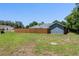 Large backyard with a new wood fence, providing privacy and space for outdoor activities at 2633 Pickett Downs Dr, Chuluota, FL 32766