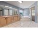 Spacious bathroom featuring a soaking tub, walk-in shower, and double sink vanity at 2633 Pickett Downs Dr, Chuluota, FL 32766