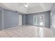 Spacious primary bedroom with tile floors, a vaulted ceiling, and access to yard at 2633 Pickett Downs Dr, Chuluota, FL 32766