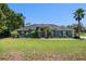 Well-maintained single-story home featuring a spacious front yard and a classic design at 2633 Pickett Downs Dr, Chuluota, FL 32766