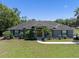 Charming single-story home with lush landscaping and a welcoming entrance at 2633 Pickett Downs Dr, Chuluota, FL 32766