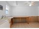 Flex room with tile floors, utility sink, and a window providing natural light at 2633 Pickett Downs Dr, Chuluota, FL 32766