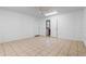 Open flex room with tile floors and an open doorway to another room at 2633 Pickett Downs Dr, Chuluota, FL 32766