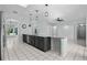 Open kitchen boasts granite countertops and dark cabinetry with tile flooring at 2633 Pickett Downs Dr, Chuluota, FL 32766