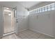Bright mud room with tile flooring, glass block window, and wire rack shelving at 2633 Pickett Downs Dr, Chuluota, FL 32766