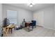 Home office space with tile floors, a desk, and a window at 2633 Pickett Downs Dr, Chuluota, FL 32766